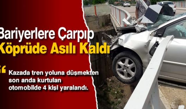 Meydana gelen trafik kazasında sürücüsünün kontrolünden çıkan otomobil köprü bariyerlerine çarparak askıda kaldı