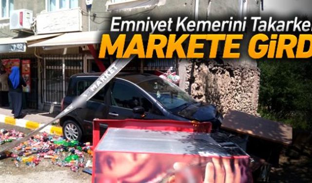 Seyir halindeyken emniyet kemerini takmaya çalışan kadın sürücü, direksiyon hakimiyetini kaybederek yol kenarındaki bir marketin meşrubat dolabına çarptı