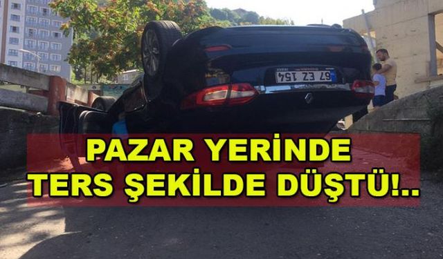 Zonguldakta soğuksu pazaryerinde bir otomobil otopark çıkışında alt yola düşerek ters döndü