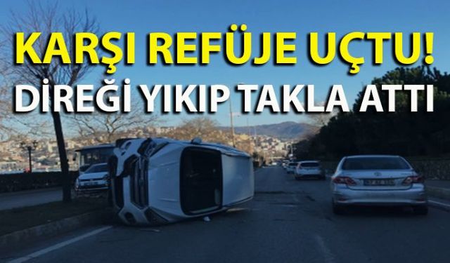 Zonguldakta sürücüsünün kontrolünden çıkan otomobil önce refüje çıktı ardından direği yıktı ve karşı şeride uçarak takla attı