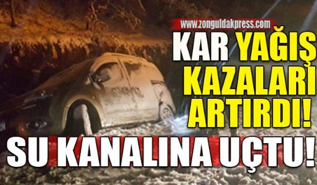 Zonguldak Ereğli yolu arasında devam eden yoğun kar yağışında sürücünün direksiyon hakimiyetini kaybettiği otomobil su kanalına uçtu